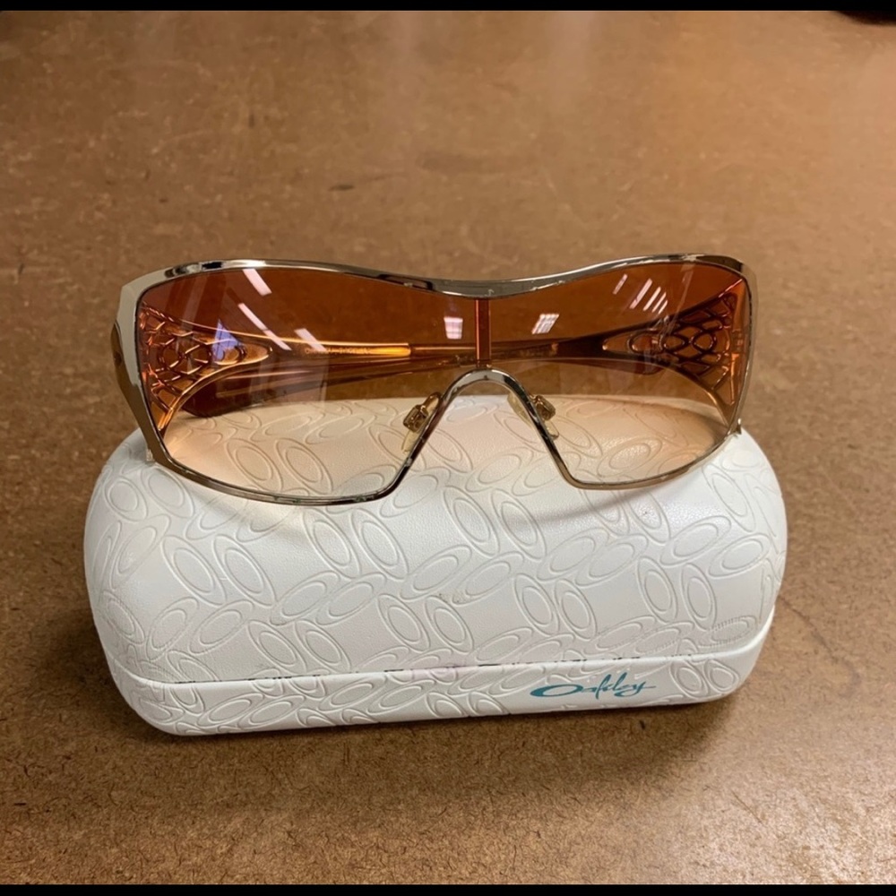 Oakley Dart Sunglasses with Gold Frame and case.